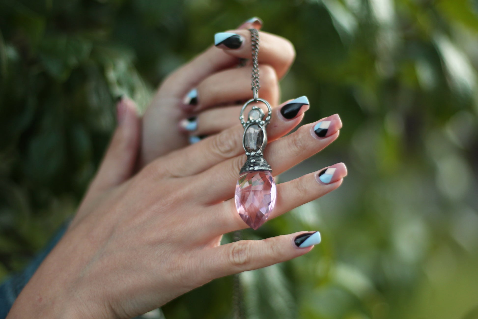 Pink crystal necklace with purple butterfly wing and moonstone