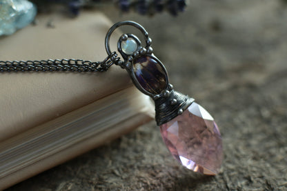 Pink crystal necklace with purple butterfly wing and moonstone