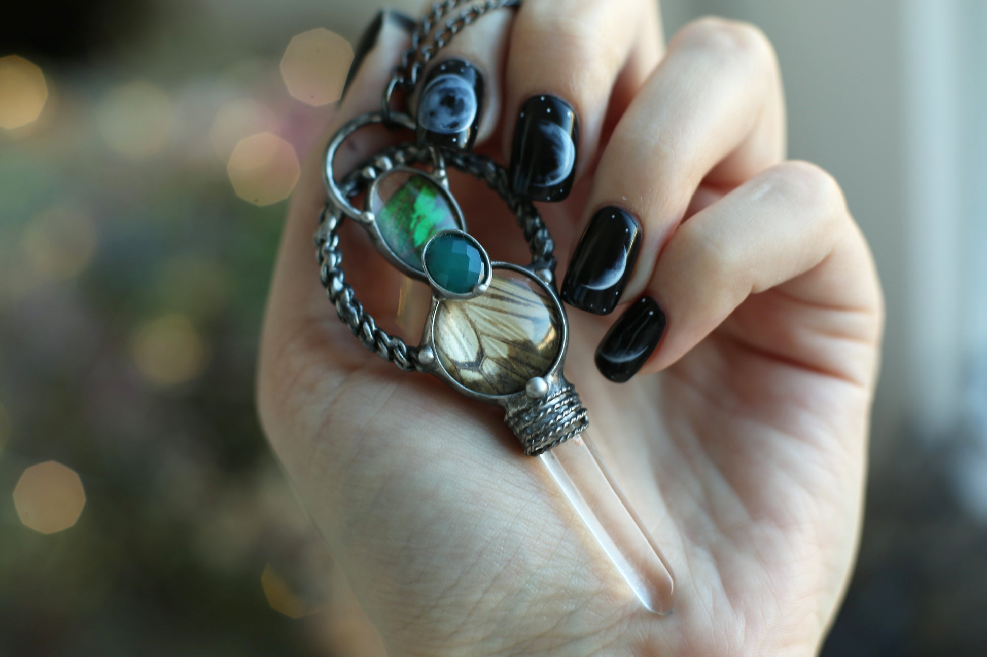 Crystal point necklace with butterfly wings