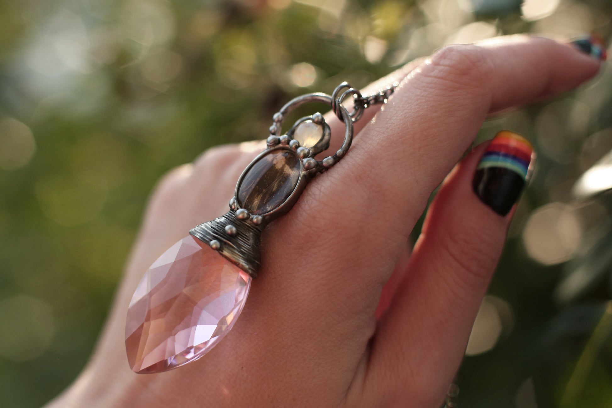 Pink crystal necklace with purple butterfly wing and moonstone