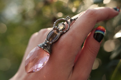 Pink crystal necklace with purple butterfly wing and moonstone