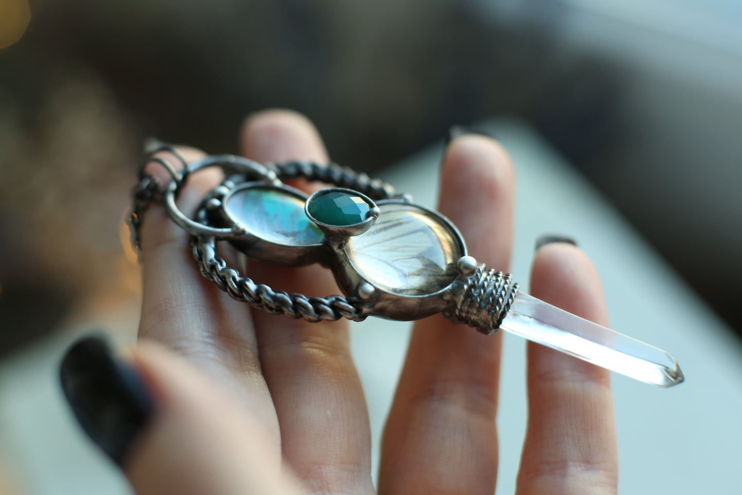 Crystal point necklace with butterfly wings