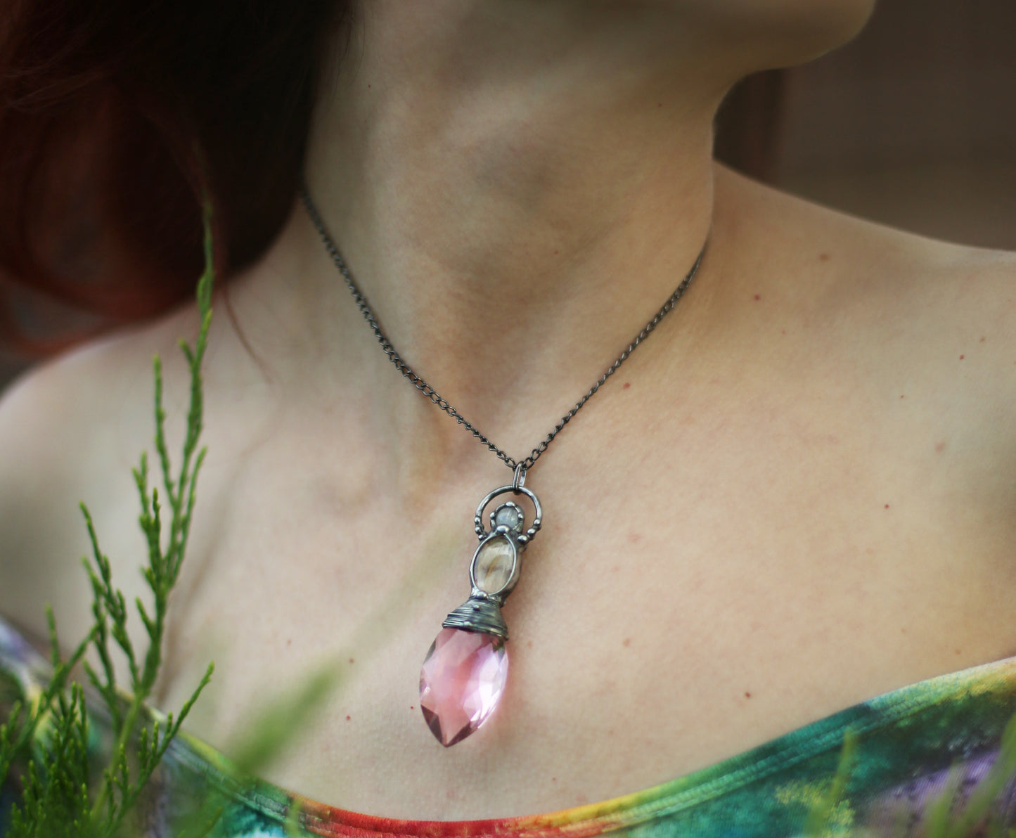 Pink crystal necklace with purple butterfly wing and moonstone