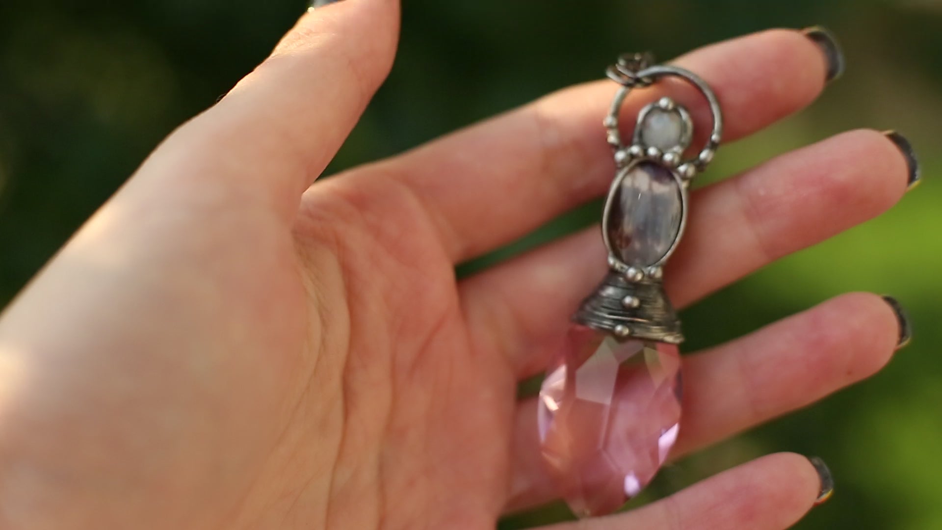 Pink crystal necklace with purple butterfly wing and moonstone